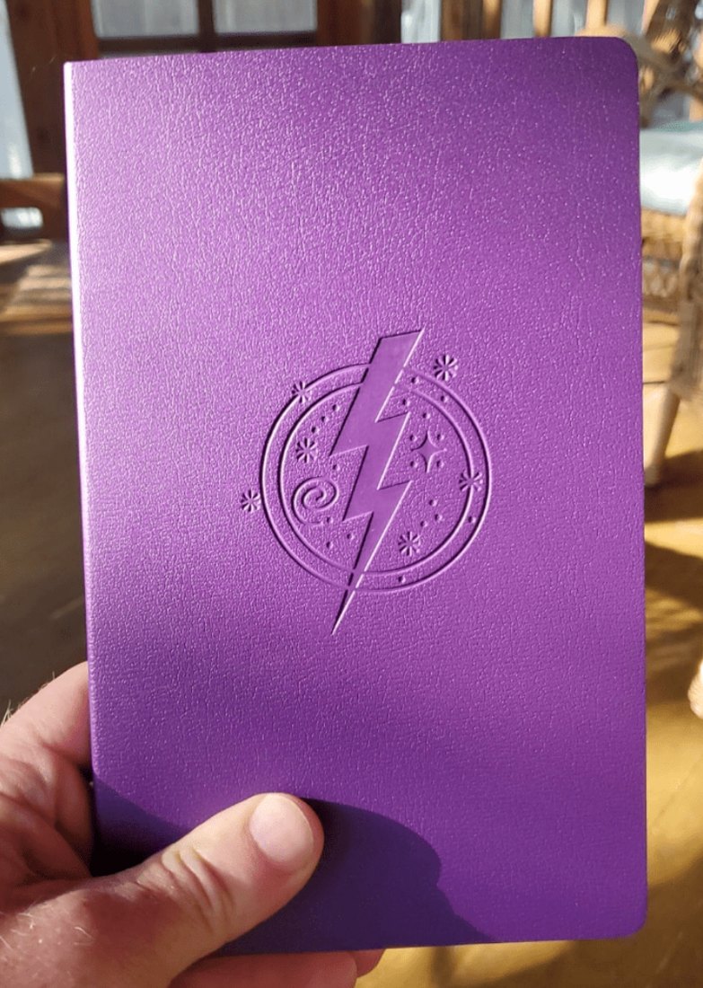 The finished Cosmic Journal: purple special edition with the embossed lightning bolt