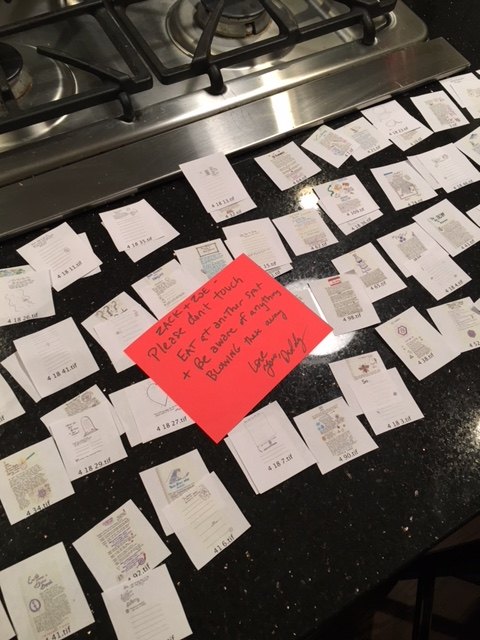 A red sticky note on the laid-out pages: Zack and Zoe, please don't touch, eat at another spot, love you, Daddy